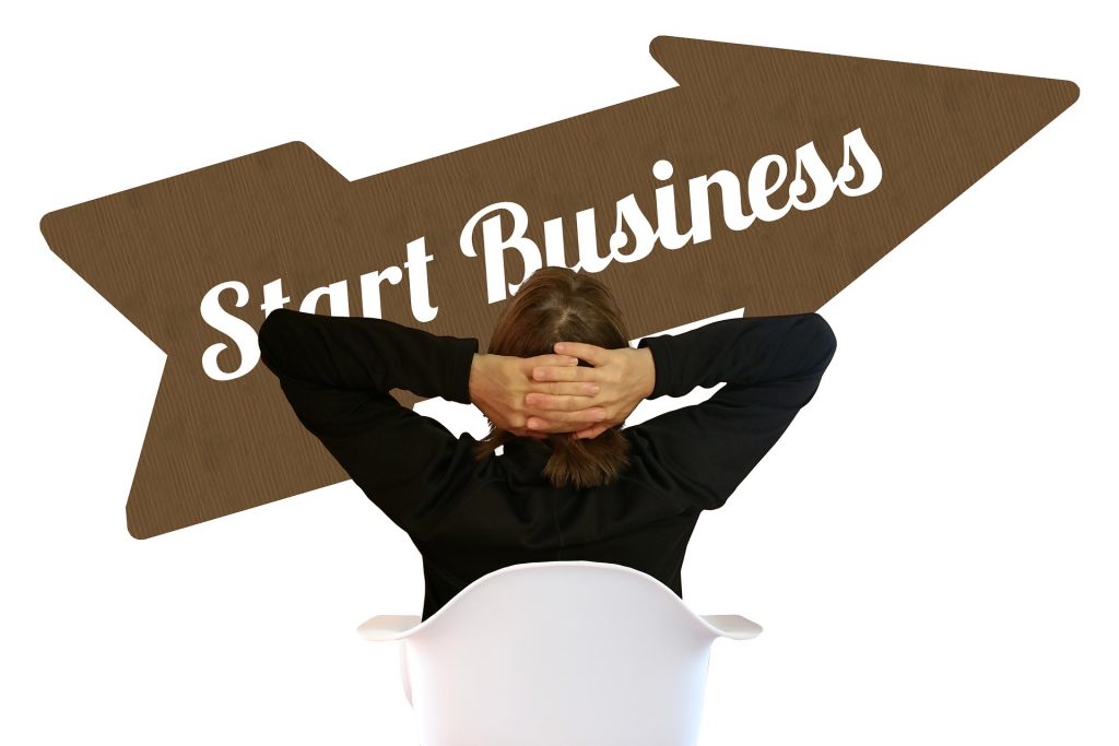 photo-of-man-and-start-business-sign